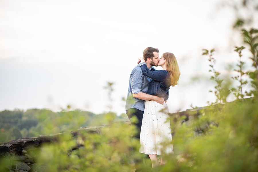 Engaged couple kissing at Brandywine Creek State Park