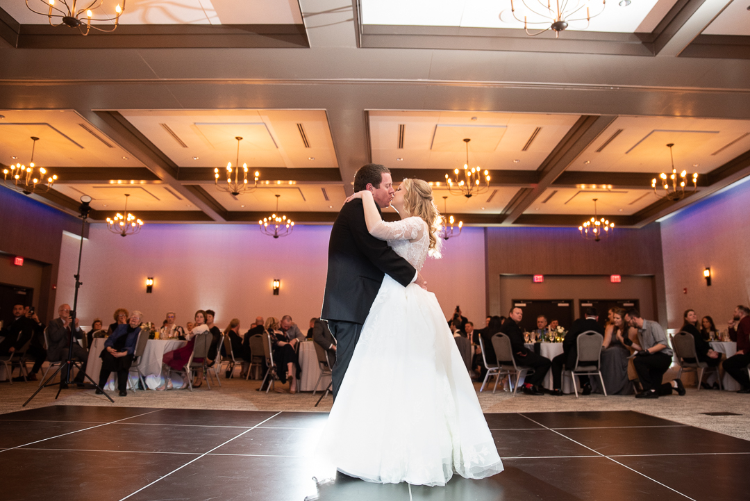 wide photo of bride and groom sharing a first dance at Riverfront Events